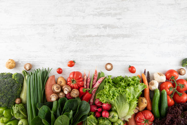 istock Fresh Vegetables on White Wooden Table 1317136871