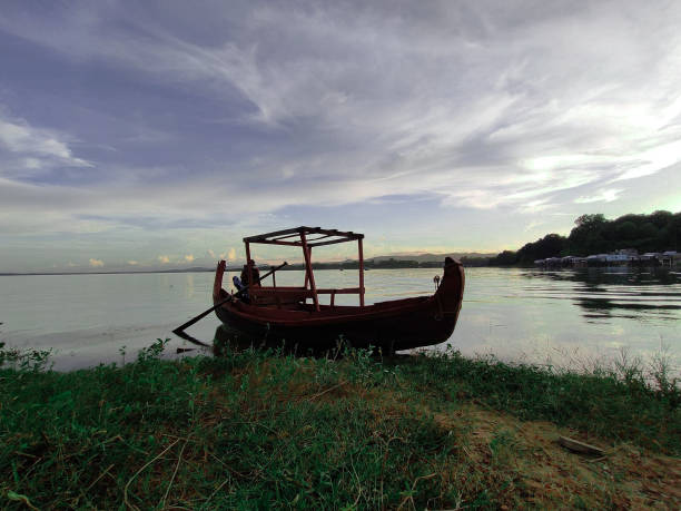 istock A boat in beautiful lake with blue sky and mountain 1317137821