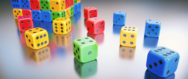 Extreme close-up on a group of colorful shiny plastic gambling dice