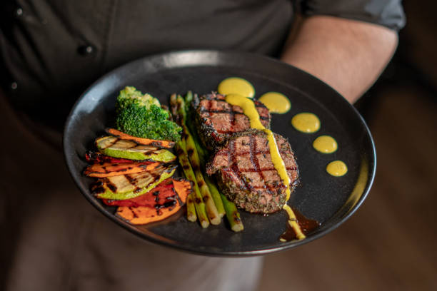 Grilled beef steak with asparagus and vegetables Grilled beef steak with asparagus and vegetables on plate eating asparagus stock pictures, royalty-free photos & images