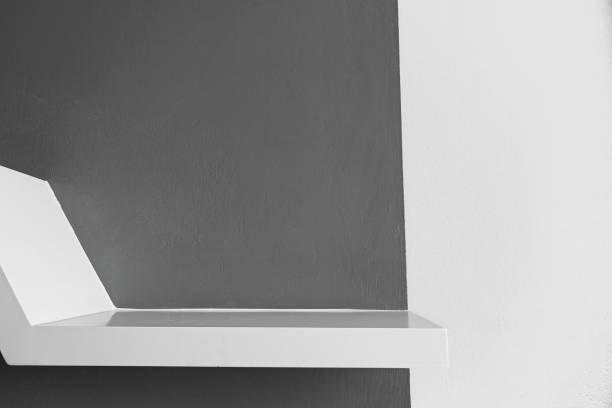 istock Empty white wood wall shelf and white concrete background. 1317139397