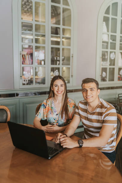 istock Young couple having conference call with laptop 1317141417