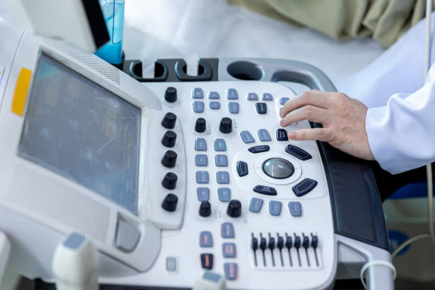 istock Doctor hand at ultrasound scanner control panel. Ultrasound machine Doctor hand use investigation. Doctor operating on a machine to perform ultrasounds on patients 1317141564