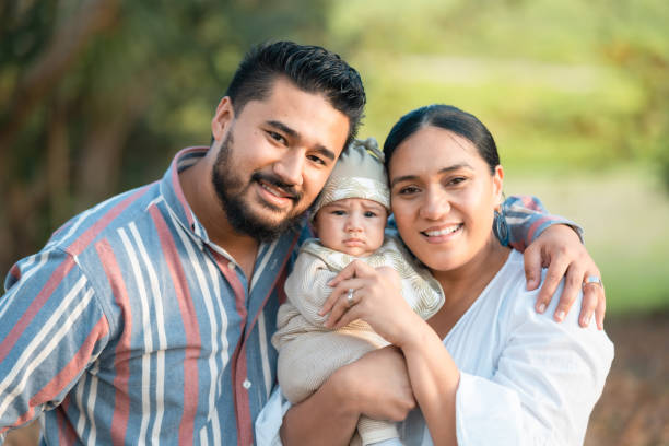 Togetherness is happiness. Happy couple enjoying outdoor with their small child. pacific islander ethnicity stock pictures, royalty-free photos & images