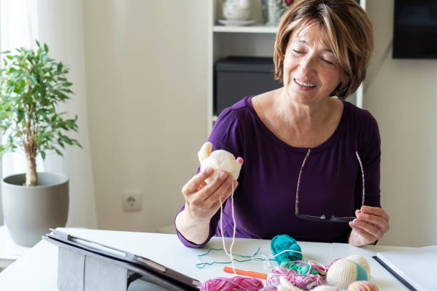 istock Senior woman working from home 1317142748