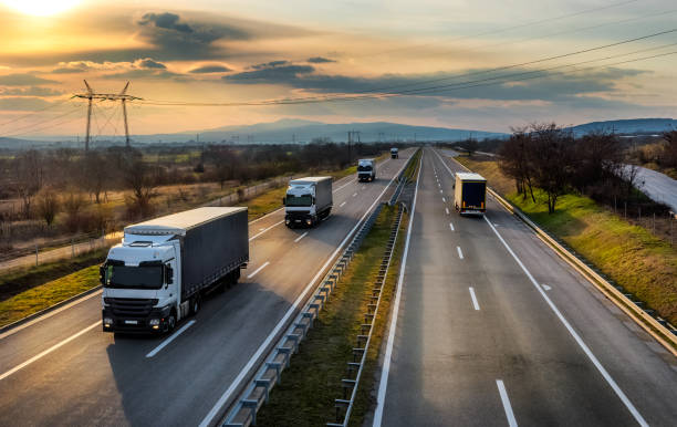 istock Highway with Convoy of transportation trucks 1317144810