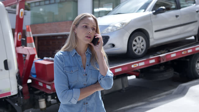 Latin american woman calling her car insurance for roadside assistance service