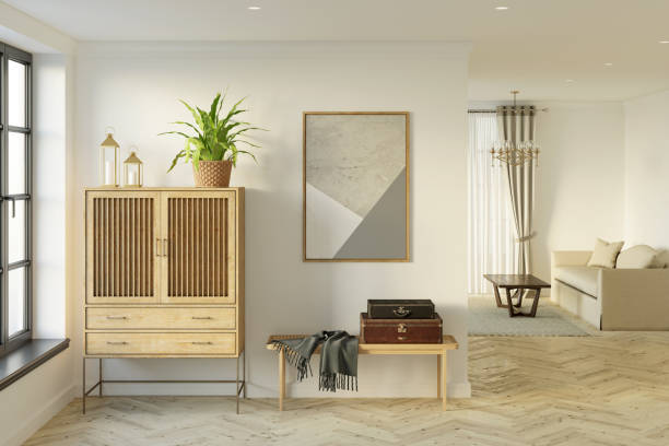 istock A bright hall with a window, a vertical poster over a wooden bench with leather suitcases, a flower in a wicker basket on a wooden dresser, a living room in the background. Front view. 1317145994