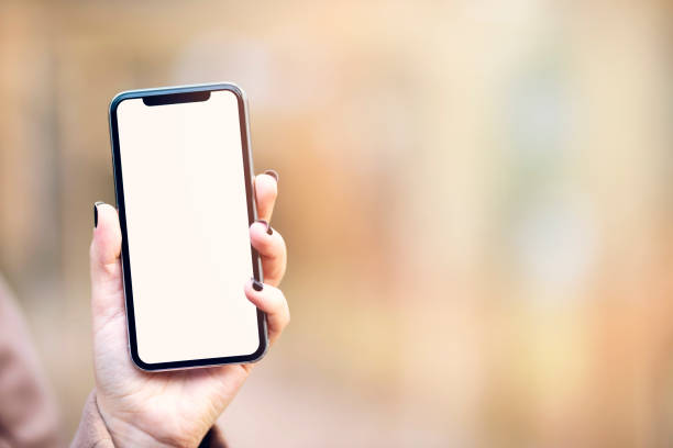 istock A hand holding black mobile phone with blank desktop screen 1317148143