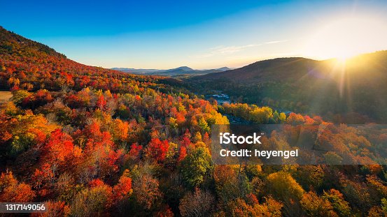 istock Aerial view of Mountain Forests with Brilliant Fall Colors in Autumn at Sunrise, New England 1317149056