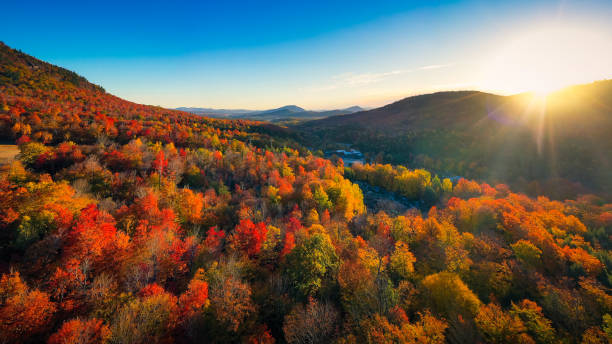 Aerial view of Mountain Forests with Brilliant Fall Colors in Autumn at Sunrise, New England Aerial view of Mountain Forests with Brilliant Fall Colors in Autumn at Sunrise, Adirondacks, New York, New England early fall stock pictures, royalty-free photos & images