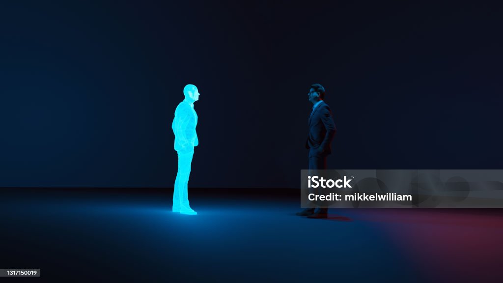 Man meets digital avatar of himself made with a hologram Man stands in a room looking at a clone or avatar of himself. The clone is shown as a hologram. Concept image of future living where cloning becomes normal. Artificial Intelligence Stock Photo