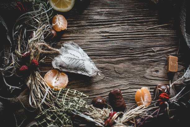 istock Creative Christmas wreath with sweets. An unusual idea for a holiday home decor. Natural interior decor on wooden background. 1317151976