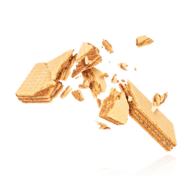 istock Crispy vanilla waffles are breaking into many pieces in the air 1317152911