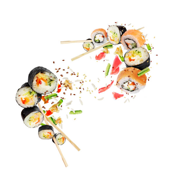 istock Different fresh sushi rolls with chopsticks hovered in white space 1317152923