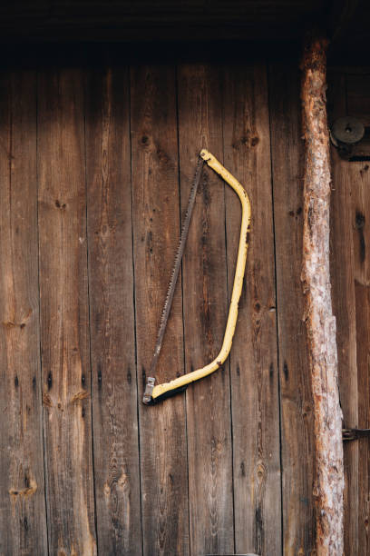 istock old metal saw hanging on a wall 1317153006