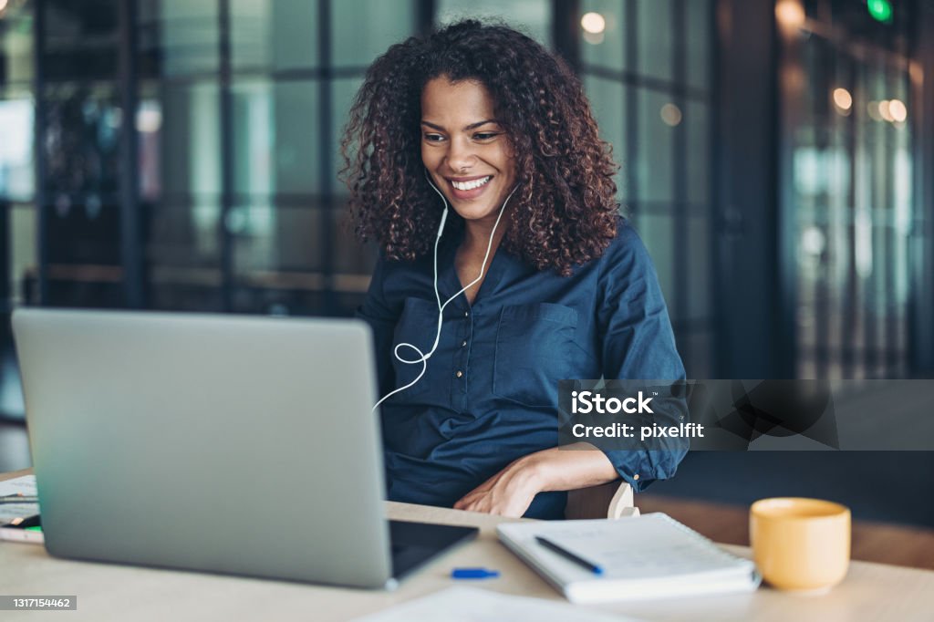 Video business meeting Businesswoman with laptop and headphones in the office Web Conference Stock Photo