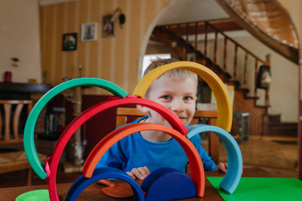 istock Little boy building wooden arches on the table 1317154724
