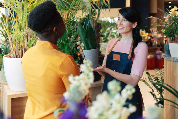 istock Woman buying fresh flowers 1317155841