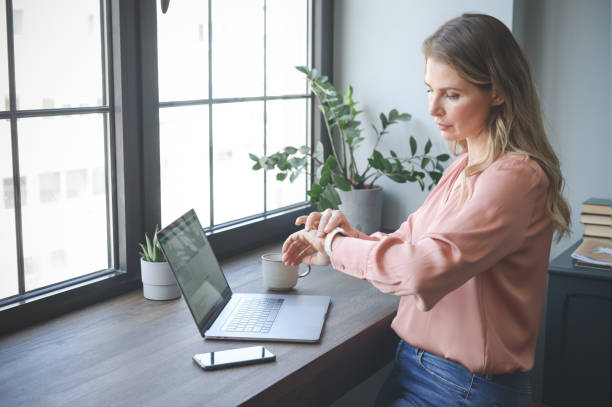 istock attractive middle aged woman working in the office ( with laptop) 1317156891