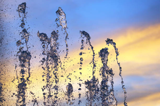 istock drops of the fountain in the setting sun 1317157604