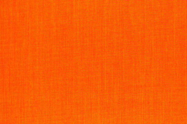 istock Macro shot of texture background. orange woven coton 1317160227