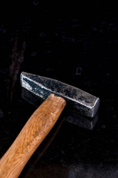 istock close-up of hammer on a black table 1317160279