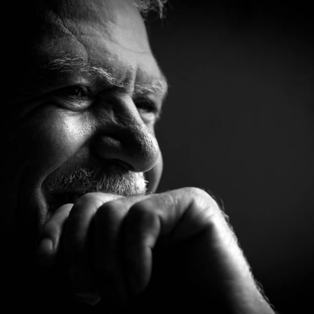 istock Man smiling and his hand on his chin 1317161683
