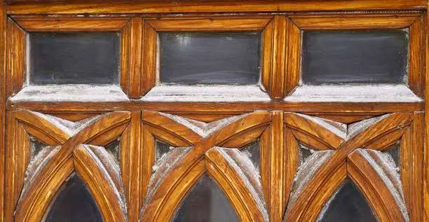 Photo of Wood and glass arched Gothic style door - detail