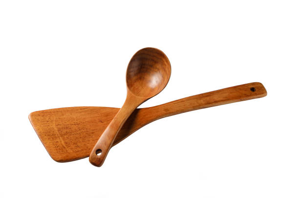 Wooden eco-friendly tableware. Bamboo spatula and spoon for cooking in different projections. Isolated on a white background.