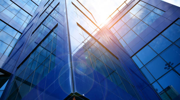 istock Modern office building with glass facade on a clear sky background. 1317167363