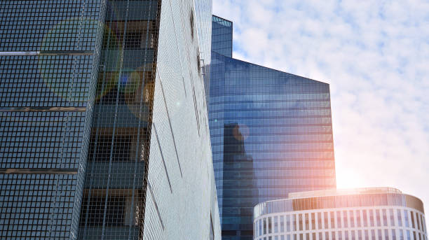 istock Modern office building with glass facade on a clear sky background. 1317167559