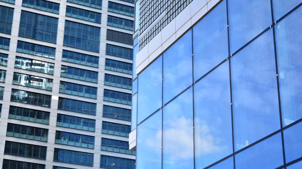 istock Modern office building with glass facade on a clear sky background. 1317167680