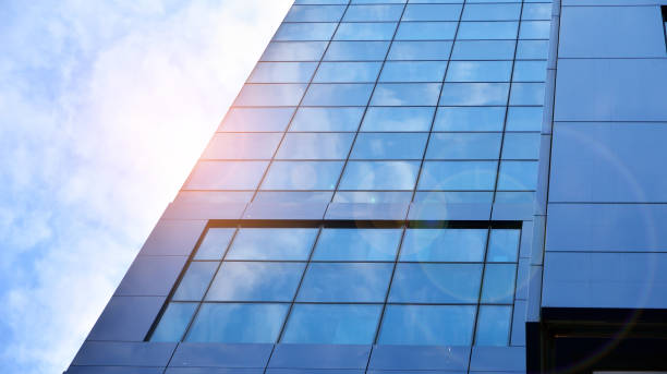 istock Modern office building with glass facade on a clear sky background. 1317167717