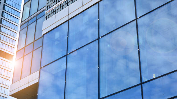 istock Modern office building with glass facade on a clear sky background. 1317168692