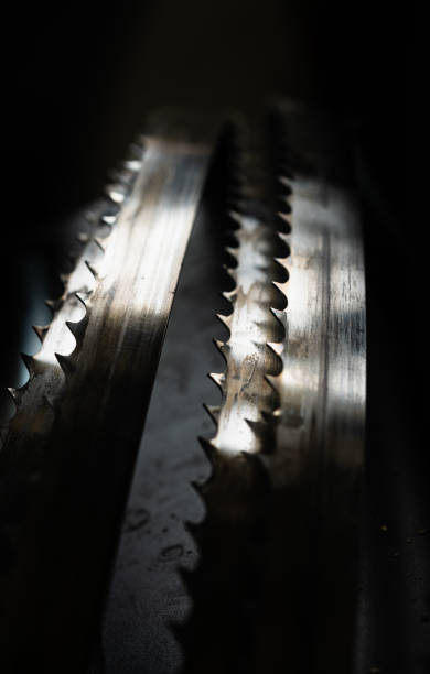 istock Abstract forms of an industrial bandsaw in front of darr backgroung 1317170549