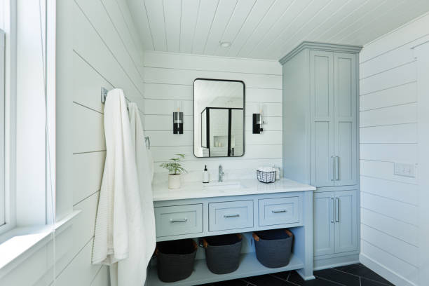 Contemporary Country Home Cabin Bathroom Design with Vanity and Linen Storage A contemporary modern bathroom design for a country home cabin. featuring a  classic freestanding vanity and linen storage cabinet. vanity mirror photos stock pictures, royalty-free photos & images