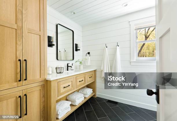 Contemporary Country Home Cabin Bathroom Design With Vanity And Linen Storage Stock Photo - Download Image Now