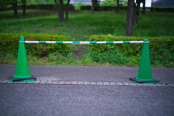 istock Green safety cones and a bar 1317175176