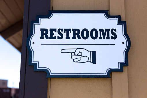 RESTROOMS Sign on Building Exterior