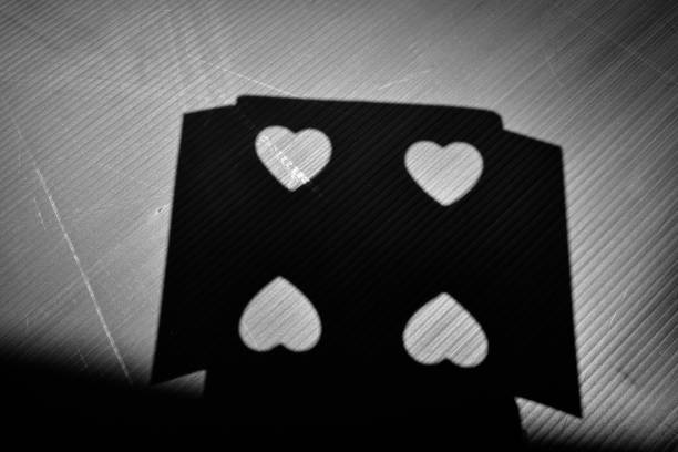 shadow of heart symbol on the black background