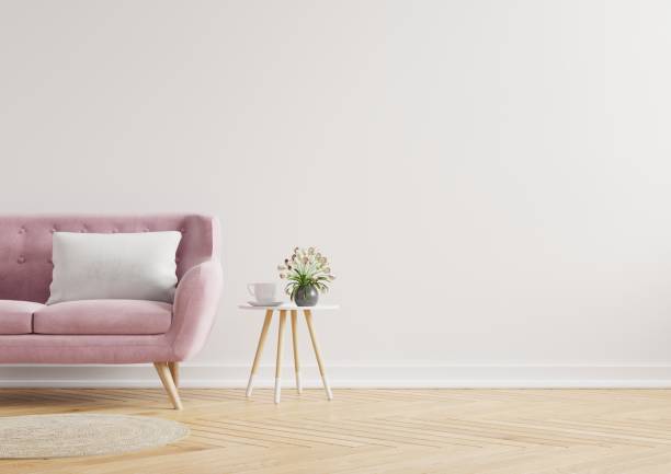 modern minimalist interior with a sofa on empty white wall background. - side table imagens e fotografias de stock