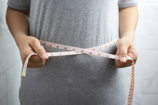 istock Obese woman needs weight control, she has excess fat. 1317198046