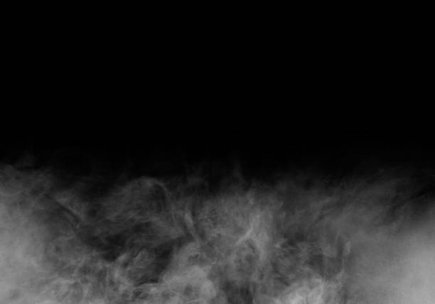 istock White smoke or fog isolated on black background. 1317200022