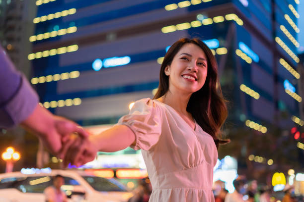 Free Stock Photo of Couple Walking Down City Street at Night | Download ...