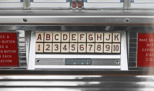 Jukebox interface with red buttons. Jukebox stock photo.