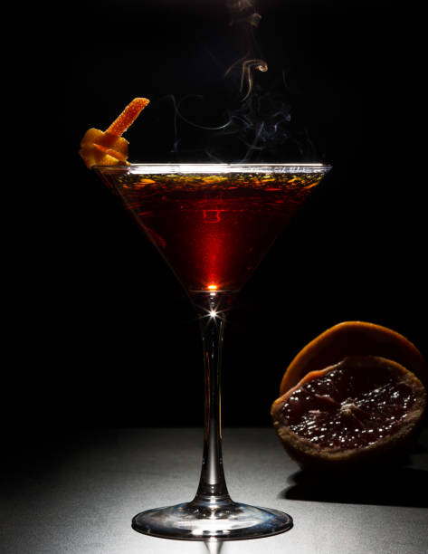 istock cocktail with orange garnish and smoke 1317202308