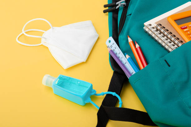 istock Backpack with protective face mask and hand sanitizer gel 1317202636