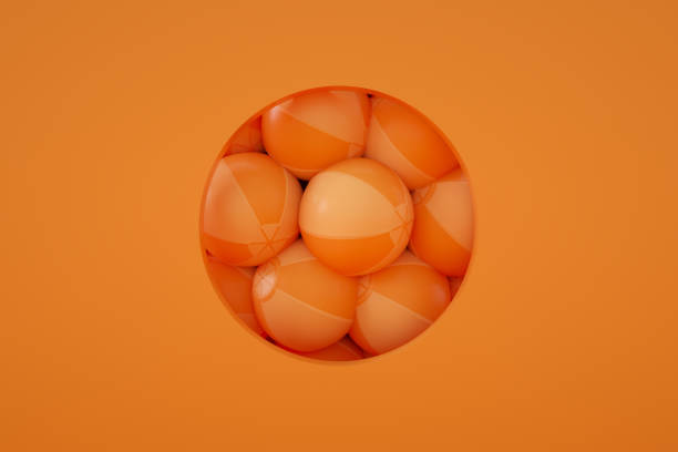 istock Minimal Summer Holiday Concept Orange Background, Beach Balls in Circle Frame 1317205116