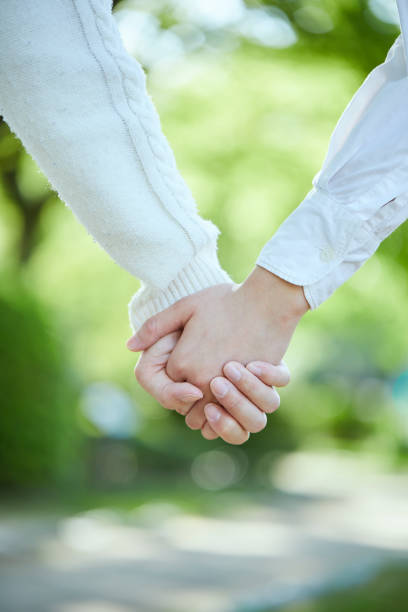 istock Hands of a couple holding hands 1317207915